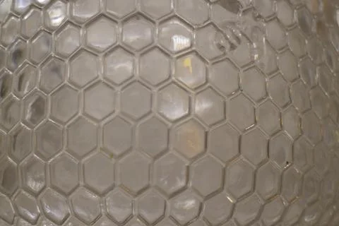 Abstract liquid viewed through hexagonal glass Stock Photos