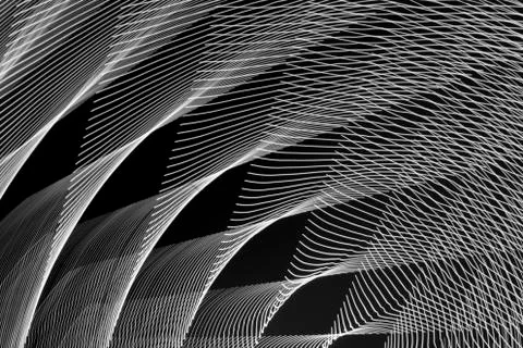 Abstract long exposure blurred light lines black and white background. Geometric Stock-Illustration