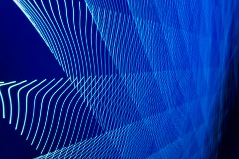 Abstract long exposure blurred light lines black and blue background. Geometric Stock-Illustration