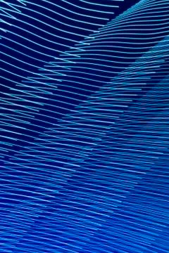 Abstract long exposure blurred light lines black and blue background. Geometric Stock-Illustration