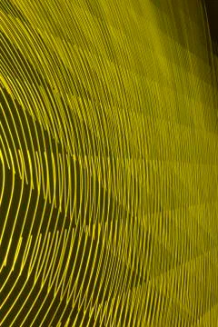 Abstract long exposure blurred light lines black and yellow background Stock-Illustration