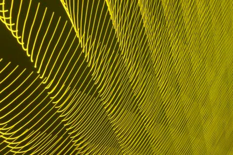 Abstract long exposure blurred light lines black and yellow background Stock-Illustration