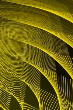 Abstract long exposure blurred light lines black and yellow background Stock-Illustration