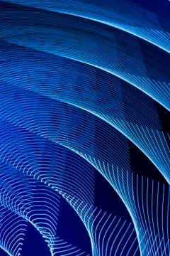 Abstract long exposure blurred light lines black and blue background. Geometric Stock-Illustration