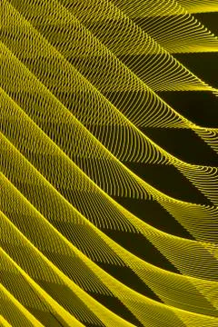 Abstract long exposure blurred light lines black and yellow background Stock-Illustration