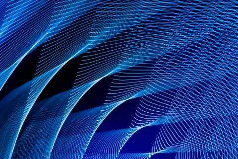 Abstract long exposure blurred light lines black and blue background. Geometric Stock-Illustration