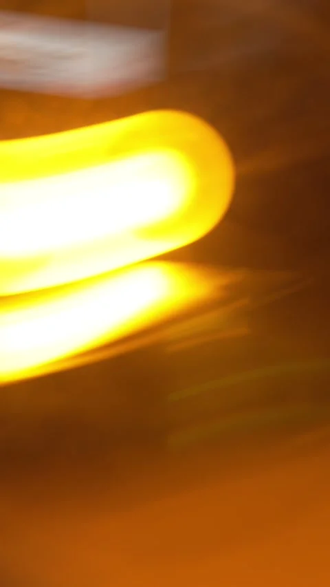 Abstract long exposure of tangled yellow glowing light trails over Stock Footage 341220599