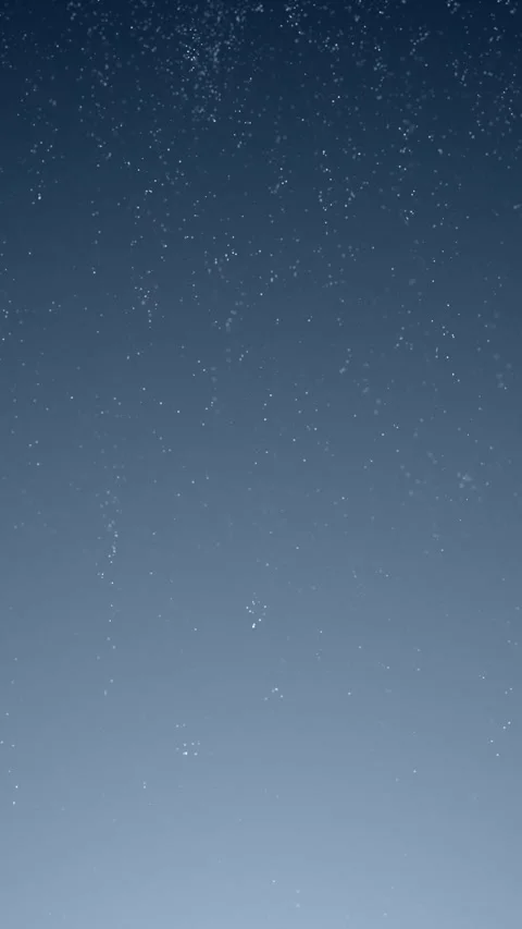 Abstract loop falling snowflakes on blue sky vertical background Stock Footage 345063182