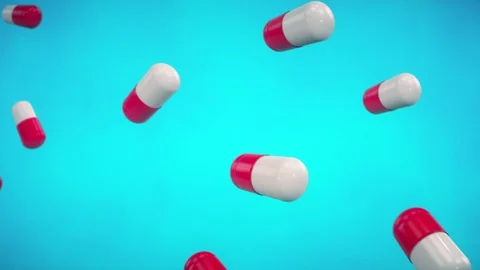 Abstract looped background with lots of flying medical pills on blue background. Stock Footage 129487814
