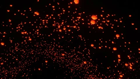 Abstract looping animated background. Particles glowing with orange-white light  Stock Footage 262604360