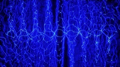 Abstract looping energy waves from particles of futuristic high-tech glowin.. Video stock 331653976