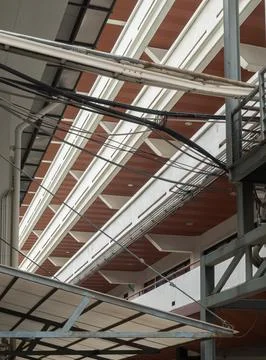 An abstract low-angle architectural perspective capturing the rhythmic, geo.. 스톡 사진