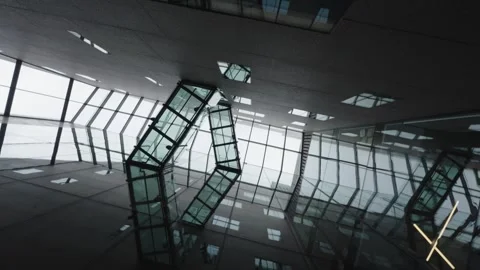 Abstract, low-angle interior shot looking up at the glass and structural steel Stock Footage 321669457