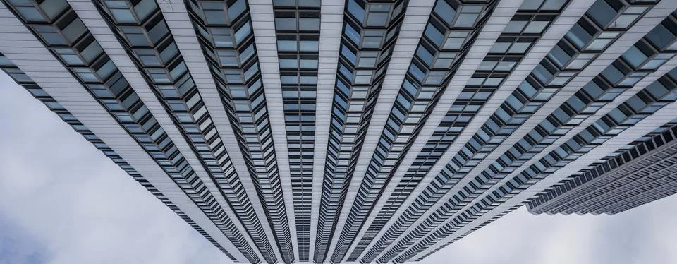 Abstract low angle view of skyscraper. Pattern of vindows on a tall building, Stock Photos