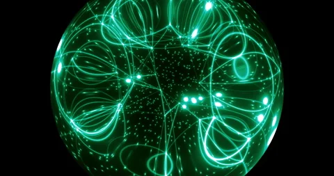 An abstract luminous sphere demonstrates the dynamic motion of particles. Stock-Footage 332774872