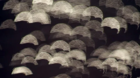 Abstract luminous water droplets like umbrellas against black background. Vídeos de archivo 47012098