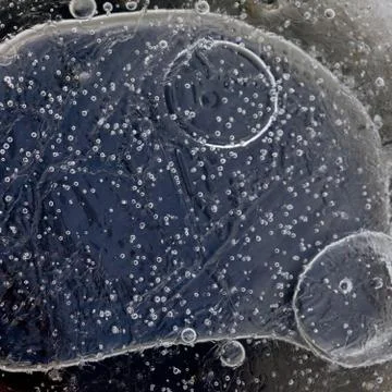 Abstract macro background bubbles inside the ice Stock Photos