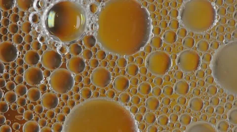 Abstract macro background with flowing oil bubbles Stock Footage 58646354