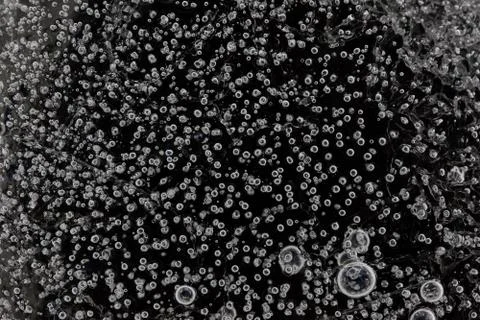 Abstract macro background. many bubbles inside the ice Stock Photos