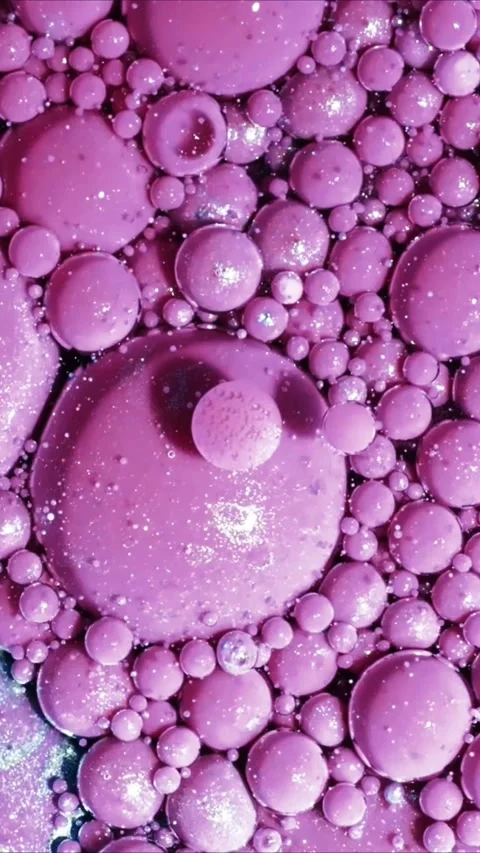 Abstract macro background of purple liquid bubbles floating in oil creating a Stock Footage 347692285