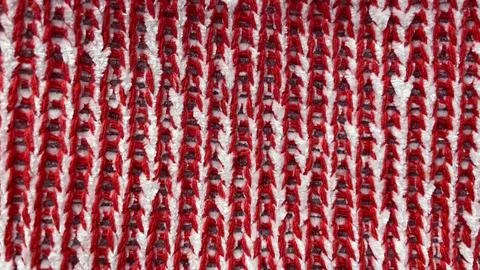 Abstract macro background of red and white knitted fabric with a distinct z.. Stock Photos