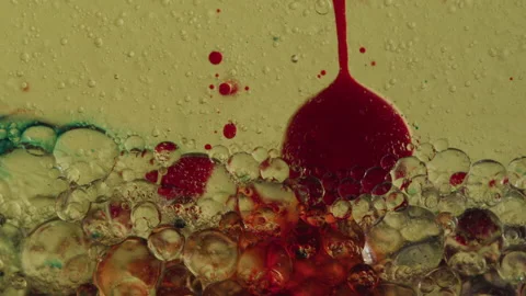 Abstract Macro Close-up of Blood Red Bubbles Sinking Through Liquid Stock Footage 208759630