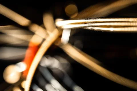 Abstract Macro Closeup of Texture Bunch of Bronze Acoustic Guitar Strings Stock Photos