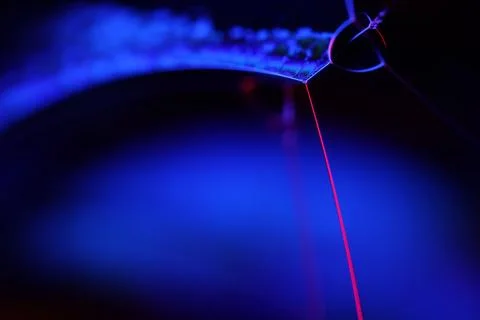Abstract macro of light refraction and lens flare in deep blue and violet tones Stock Photos