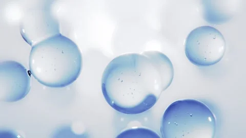 Abstract Macro Liquid Bubbles and Blue Glass Cells Floating Stock Footage 325654375