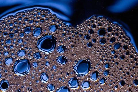 Abstract macro liquid texture with bubbles stock photo Stockfoto's