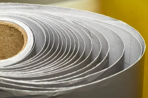 Abstract Macro of Material Roll in a Spiral Pattern, Industrial Geometric T.. Foto stock
