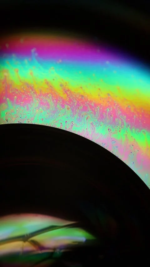 Abstract Macro of Rainbow Iridescent Soap Bubble Film Stock Footage 334110061