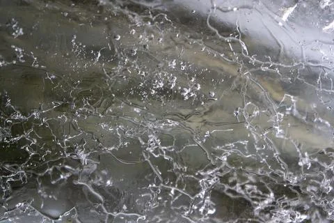 Abstract Macro Shot of Ice Surface with Cracks and Bubbles Stock Photos
