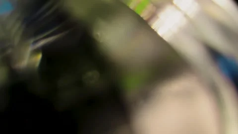 Abstract macro shot of light refraction through a glass prism Stock Footage 344986009