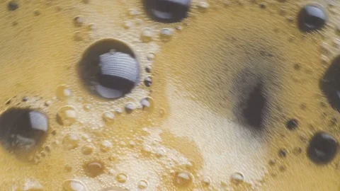 Abstract macro  spinning coffee bubbles background. Stock Footage 73702095