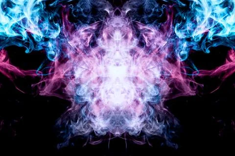 Abstract magic background. Cloud of  pink and blue smoke in the form of a sku 스톡 사진
