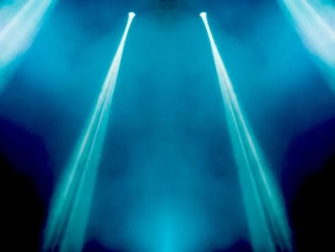 Abstract magic image with rays of colored light from the spotlights in the da Stock Photos