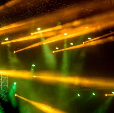 Abstract magic image with rays of colored light from the spotlights in the da Stock Photos