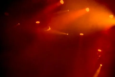 Abstract magic image with red rays of colored light from the spotlights in th Stock Photos