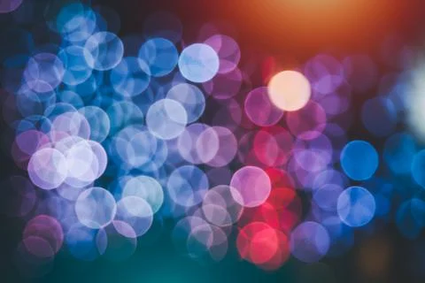 Abstract magical bokeh lights effect background, black, gold glitter for Chri Stock Photos