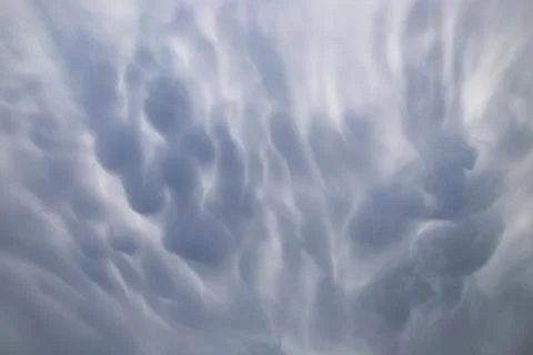 Abstract Mammatus Cloud Patterns Captured in Soft Natural Light Stock Photos