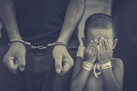 Abstract of the man was bound by hand in the shackle,human trafficking Stock Photos