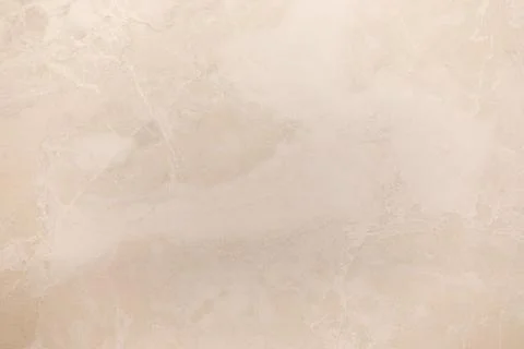 Abstract marble texture with subtle patterns in a light beige hue creating a Foto stock
