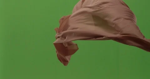 Abstract material floating cloth fabric against green screen in slow motion Vídeo Stock 104314086