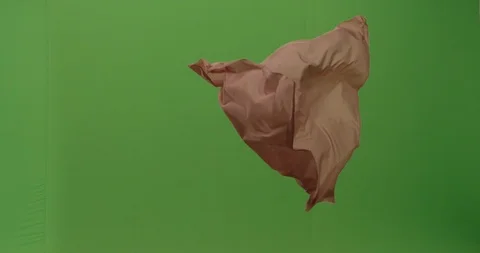 Abstract material floating cloth fabric against green screen in slow motion Stock Footage 104314535