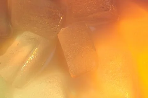 Abstract melt orange ice background Stock Photos