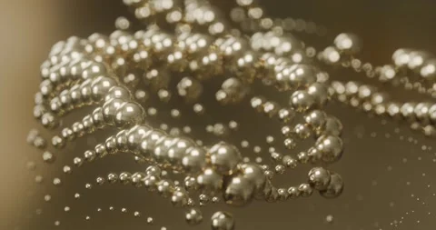 Abstract metallic spheres and bead chains with golden bokeh looping animation 库存影片 335253672