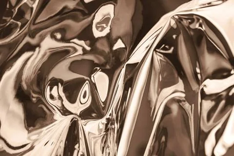 Abstract metallic surface with reflections in soft brown tones Stock Photos