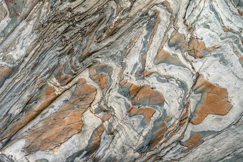 Abstract mineral pattern formed by various mineral encrustations on a slate.. Stock Photos