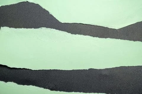 An abstract minimalist background featuring layered torn paper in mint gree.. Фото